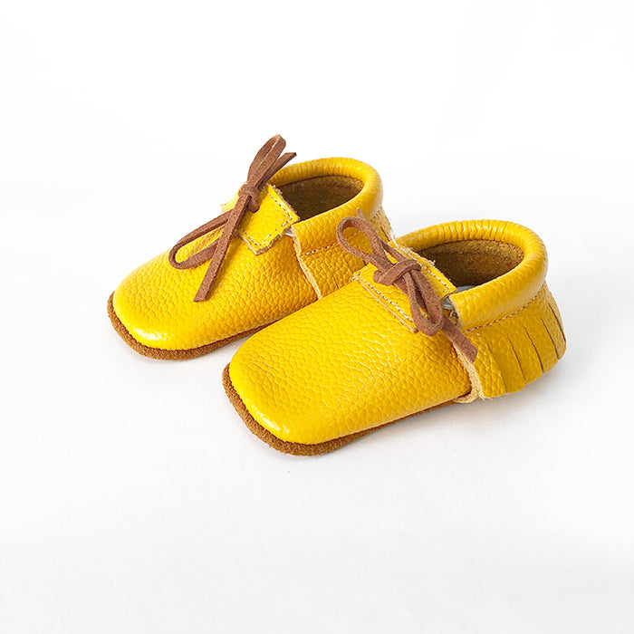 Our Rowan moccasins are the perfect first shoe for your new born baby or your toddling mini. We have made a shoe that is just right for your little ones developing feet. Our soft soles (up to 12months) cushion your child’s feet, allowing the shoe to be flexible and encourage the natural foot development of your baby, pre walker, or toddler. We have added soft grips for walkers and toddlers.