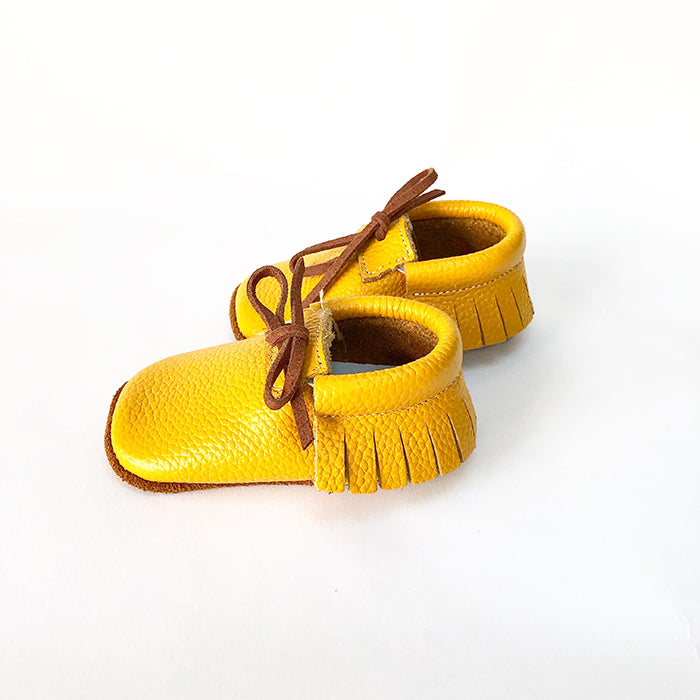 Our Rowan moccasins are the perfect first shoe for your new born baby or your toddling mini. We have made a shoe that is just right for your little ones developing feet. Our soft soles (up to 12months) cushion your child’s feet, allowing the shoe to be flexible and encourage the natural foot development of your baby, pre walker, or toddler. We have added soft grips for walkers and toddlers.
